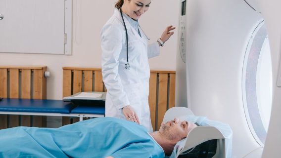 attractive-smiling-doctor-preparing-man-for-scanning-in-mri-machine.jpg